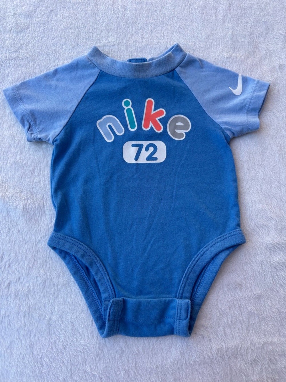 Nike Blue Short-Sleeve Baby Bodysuit with Multicolor Logo